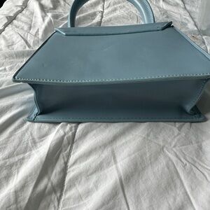 Jaquemis baby blue purse - Across the water. If you know you know